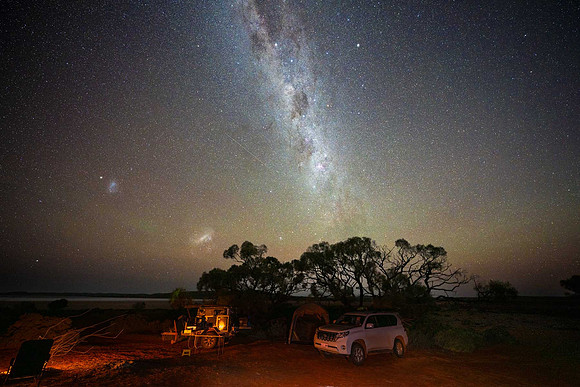 Milky Way and two of its closer neighbouring galaxies, the Large and Small Magellanic Clouds (on the left)